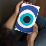 Unveiling the Ancient Evil Eye - Spiral notebook