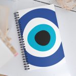 Unveiling the Ancient Evil Eye - Spiral notebook