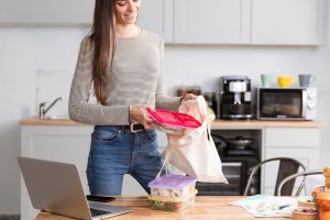 A busy mom holding a canvas tote bag